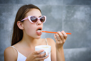 Obraz premium Young woman enjoy sipping drink through straw. Pretty woman sip beverage with drinking straw. Cute woman drink through straw in cafe. Taste the freshness.