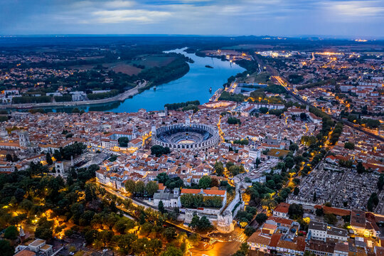 France, Provence-Alpes-Cote dAzur, Arles, Aerial view of Arles Amphitheatre and surrounding buildings at dusk