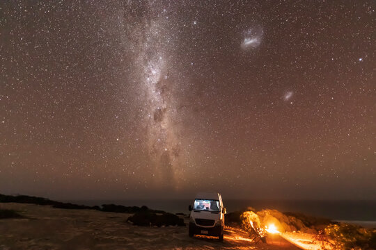 Milky Way over lone woman camping in&Ocirc;&oslash;&Omega;Nullarbor National Park at night