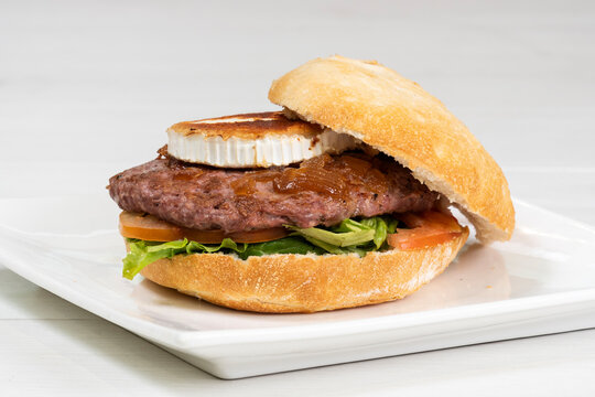 Goat cheese, caramel onion, lettuce and tomato burger