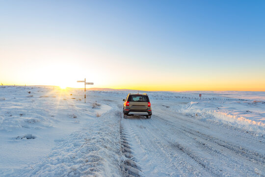 UK, Scotland, East Lothian, Winter sunrise over road through rural landscape