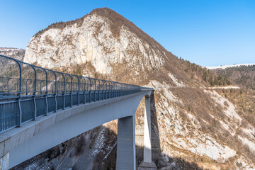 View of a road viaduct acroos a canyon in the mountains on a clear winter day