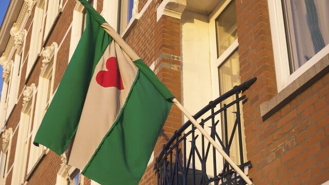 Green-white-green flag of Rotterdam with the Heart on a Building Fascade