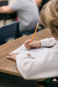 Classroom: Anonymous Boy Works On Math Test