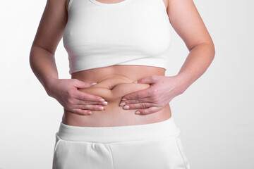 A woman using pinch test as one of the methods for measuring body fat