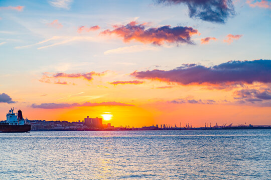 Beautiful waterfront, sky and clouds during sunset, view on Gravesend Bay in Brooklyn , New York