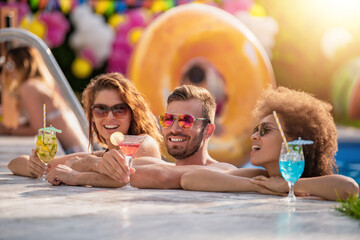Group of friends have pool party