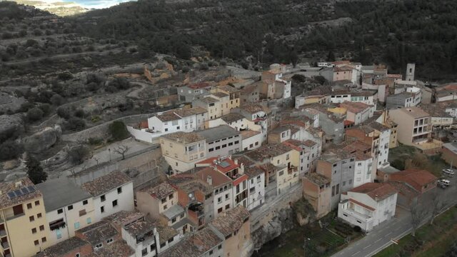 Panoramic view of small houses on the rocky hill in Margalef, Tarragona. Aerial view of beautiful old homes in historical village on the rocky mountain side in Catalonia, Spain