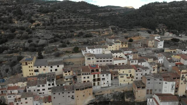 Aerial view of colorful local houses on the hillside in Margalef, Tarragona. Small historical village on the rocky mountain side in Catalonia, Spain