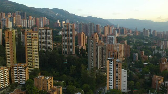Flying Between Apartment Buildings in Colombia on Clear Day at Sunset