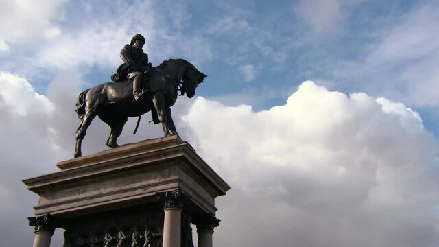 Pan: Massive Bronze Statue Of Earl Roberts On A Horse Before Sweeping Blue Sky With Majestic Clouds