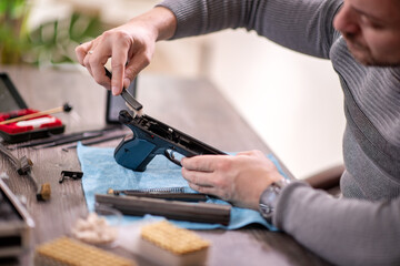 Man cleaning gun