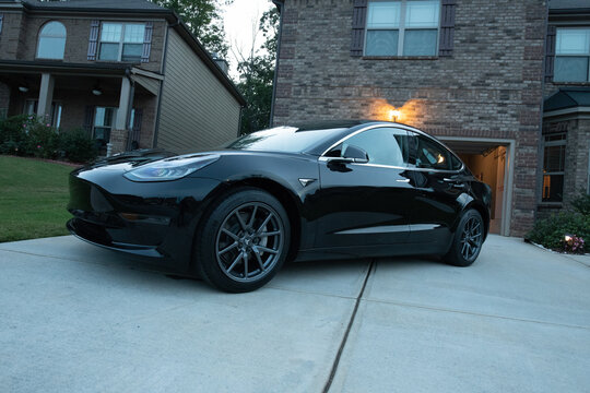 Black Tesla Model 3 Parked At Home