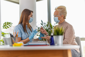 Female doctor giving a consultation to a senior patient