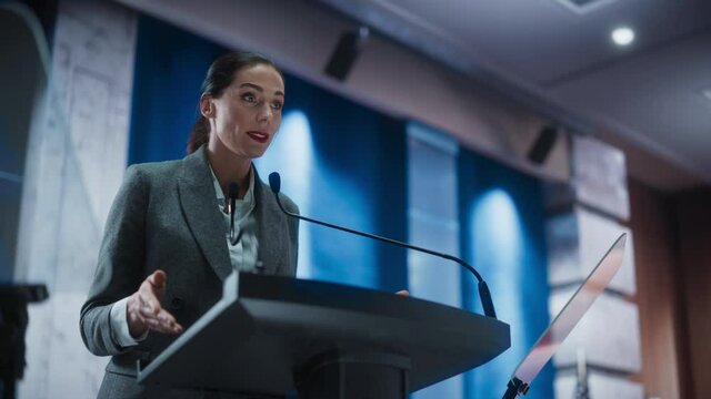Portrait of Organization Female Representative Speaking at Press Conference in Government Building. Press Office Representative Delivering a Speech at Summit. Minister Speaking to Congress Hearing.
