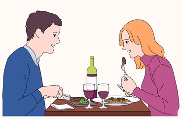 A couple is facing each other and smiling. They are having a romantic meal in a nice restaurant.