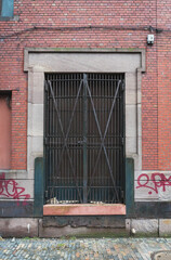 Fototapeta na wymiar red brick building with double door