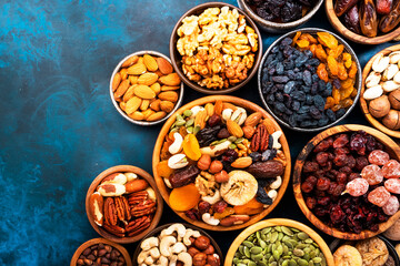 Nuts and dried fruits. Dried apricots, figs, prunes, raisins, cranberries, pecans, walnuts, pistachios, cashews, hazelnuts, almonds and other. Food background, top view