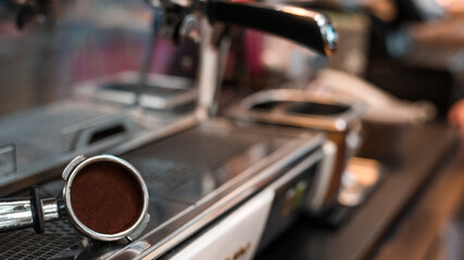 Fototapeta na wymiar coffee tamper to coffee machine