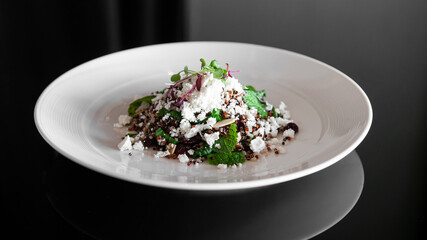 Quinoa salad with feta cheese and almond and mint leaves