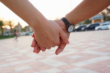 couple holding hands