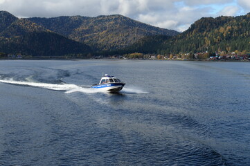 A transport police boat is patrolling the waters of Lake Teletskoye. Altai Republic