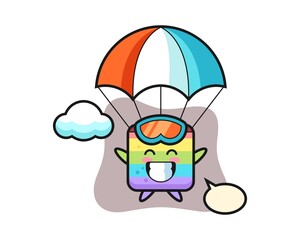 Rainbow cake mascot cartoon is skydiving with happy gesture