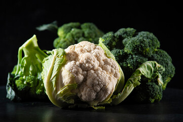 cauliflower with broccoli on a dark background