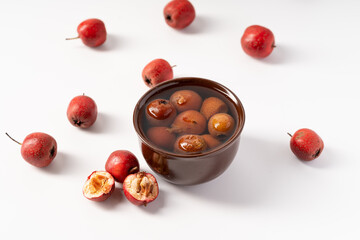 Fresh hawthorn juice on pure white background