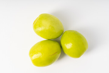 Multiple fresh milk dates on pure white background