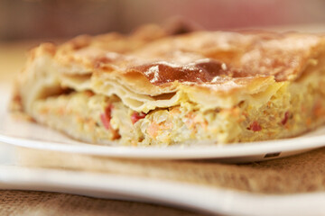 Chicken and potato pie on the dining table. The food is ready to eat. Puff pastry. kitchen utensils for cooking