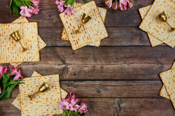 Passover background with matzah and wine cups.