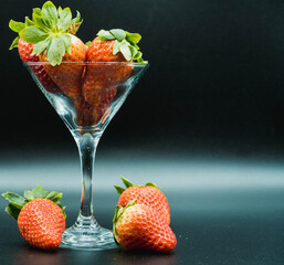 class cup and strawberries