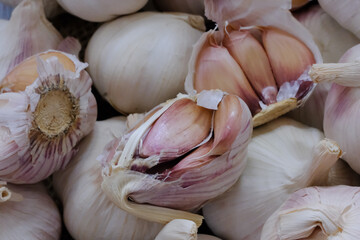 Garlic, spices for cooking are placed in the kitchen.