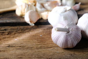 Garlic, spices for cooking are placed in the kitchen.