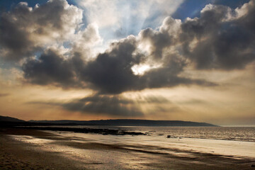 Fototapeta na wymiar beautiful dramatic sunset in the shores of Swansea,Wales