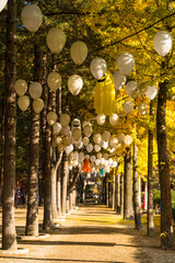 Gapyeong,South Korea-October 2020: Autumn foliage forest tree with balloons and ghost halloween decorations hanging on the tree in Nami Island, South Korea