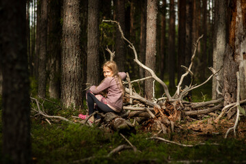 10-year-old girl in the woods, selective focus