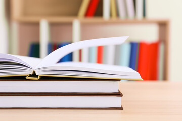 Stack of books on table in room