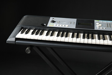 Fototapeta premium Stylish synthesizer on dark background, closeup