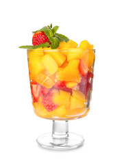 Glass bowl with tropical fruit salad on white background