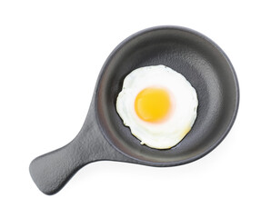 Frying pan with tasty egg on white background