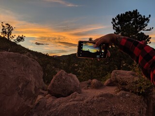 Cellphone catpuring sunset