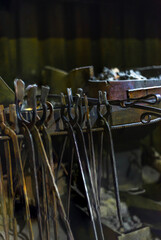 Blacksmith's tools, against the background of a cold blacksmith's forge