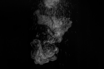 Original white curly steam with beautiful splashes of water on a black background. Abstract background, element for design