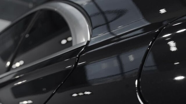 Petrol cap cover and door of modern car. Closeup cinematic 4k slow motion shot.	