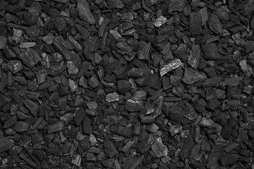 Black charcoal texture background. Carbon residue from burning wood.