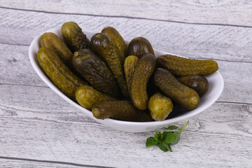 Pickled cucumbers heap in the bowl
