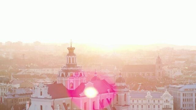 St. Peter and St. Paul's Church in magical Sunset light. Aerial wide shot of Old Town, Vilnius.