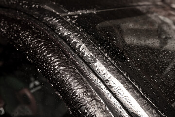 Ice on the car. Rain